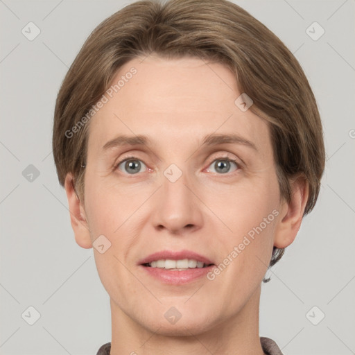 Joyful white adult female with short  brown hair and grey eyes