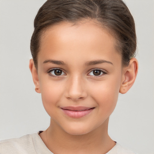 Joyful white child female with short  brown hair and brown eyes