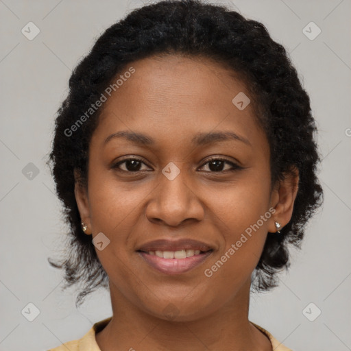 Joyful black adult female with short  brown hair and brown eyes