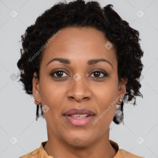 Joyful black adult female with short  brown hair and brown eyes