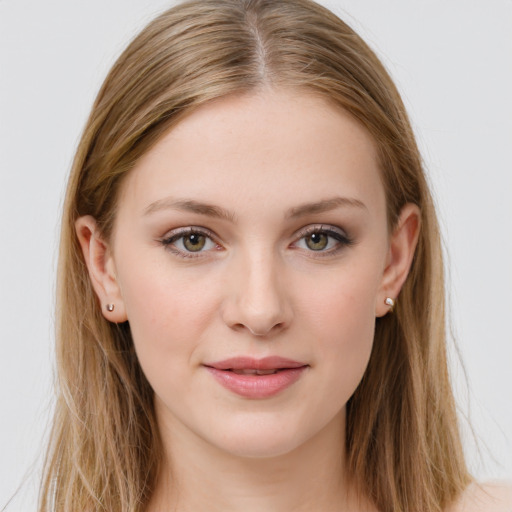 Joyful white young-adult female with long  brown hair and green eyes