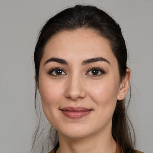 Joyful white young-adult female with medium  brown hair and brown eyes