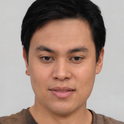 Joyful asian young-adult male with short  brown hair and brown eyes