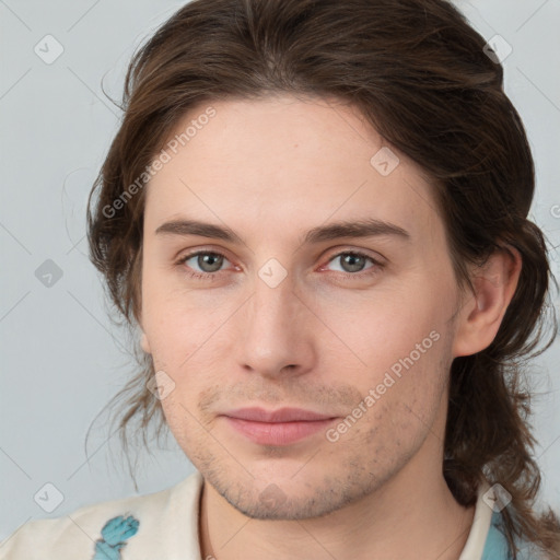 Joyful white young-adult male with medium  brown hair and brown eyes