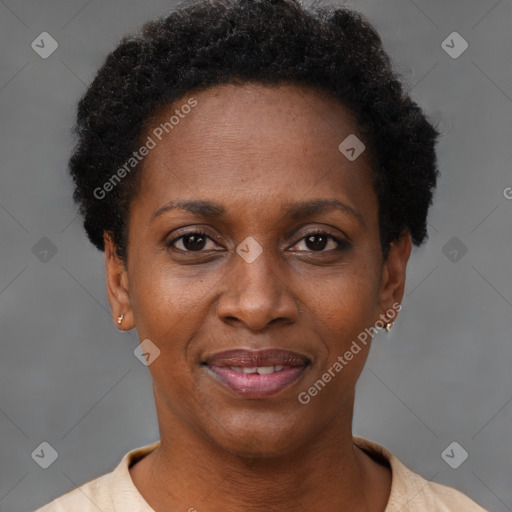 Joyful black adult female with short  brown hair and brown eyes