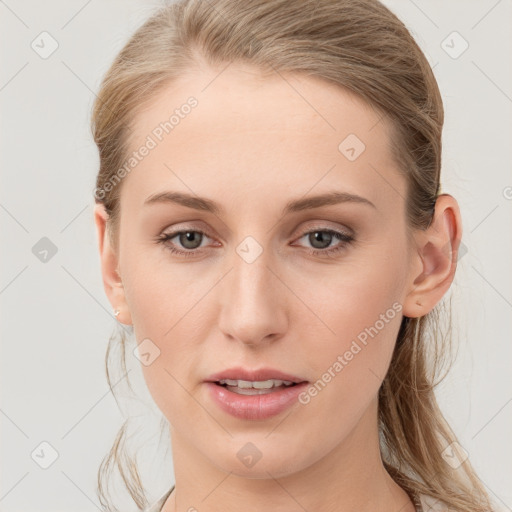 Joyful white young-adult female with long  brown hair and blue eyes