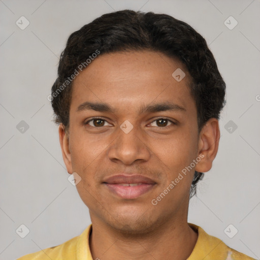 Joyful latino young-adult male with short  brown hair and brown eyes