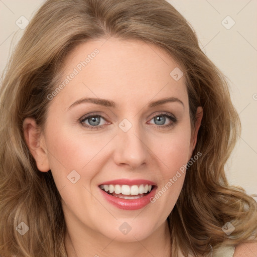 Joyful white young-adult female with long  brown hair and green eyes