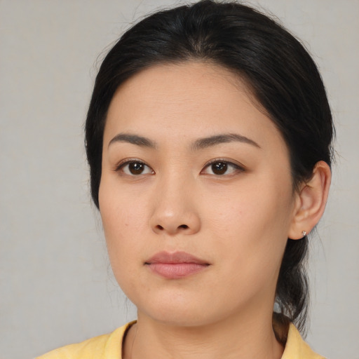 Neutral asian young-adult female with medium  black hair and brown eyes