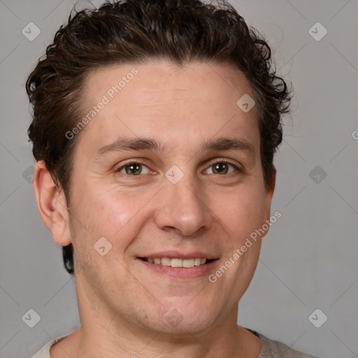 Joyful white adult male with short  brown hair and grey eyes