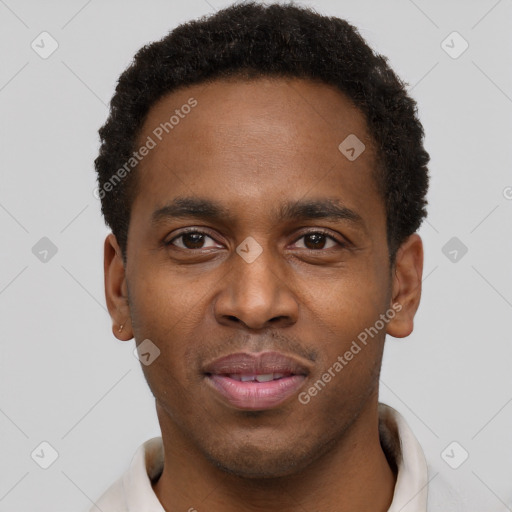 Joyful black young-adult male with short  brown hair and brown eyes