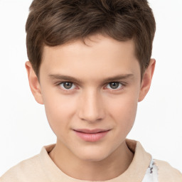 Joyful white child male with short  brown hair and brown eyes