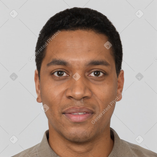 Joyful black young-adult male with short  black hair and brown eyes