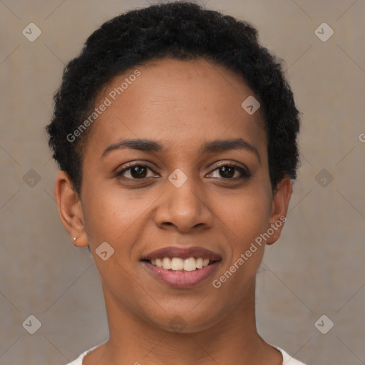 Joyful black young-adult female with short  brown hair and brown eyes