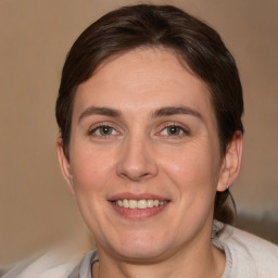 Joyful white adult female with short  brown hair and brown eyes