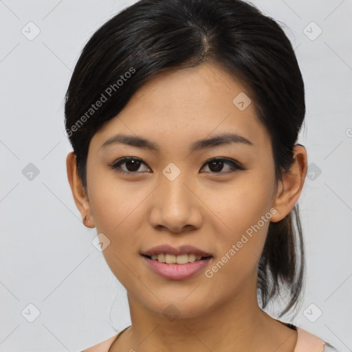 Joyful asian young-adult female with medium  black hair and brown eyes