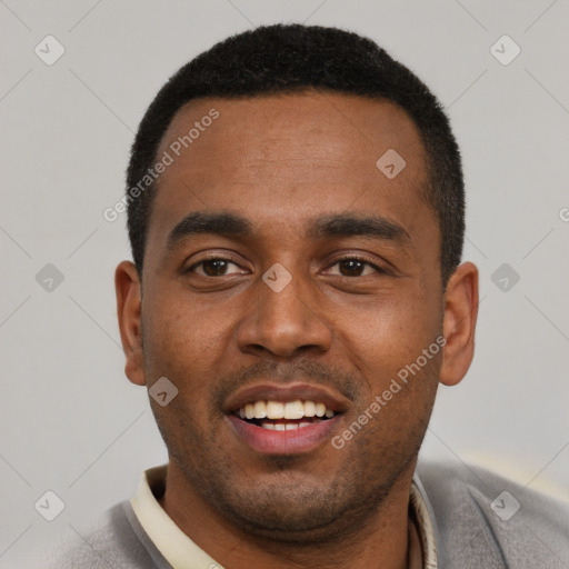 Joyful black young-adult male with short  black hair and brown eyes