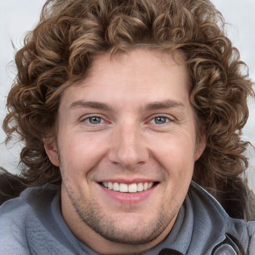 Joyful white young-adult male with medium  brown hair and brown eyes