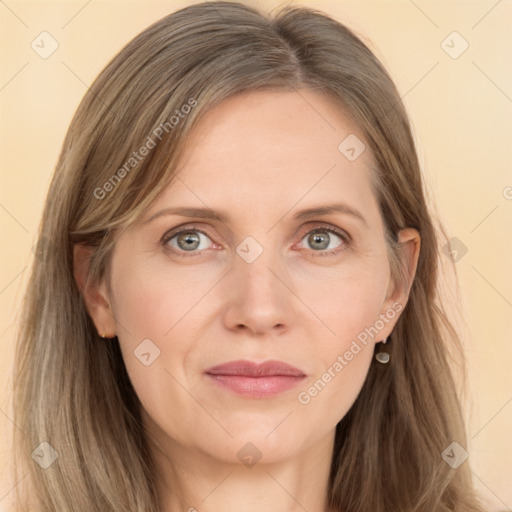 Joyful white adult female with long  brown hair and grey eyes