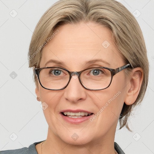 Joyful white adult female with medium  brown hair and blue eyes