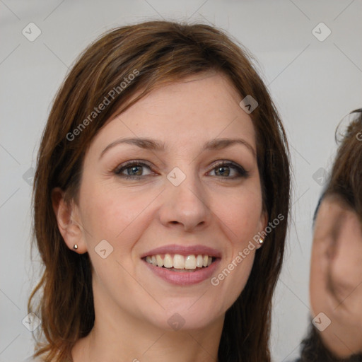 Joyful white young-adult female with medium  brown hair and grey eyes