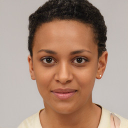 Joyful black young-adult female with short  brown hair and brown eyes