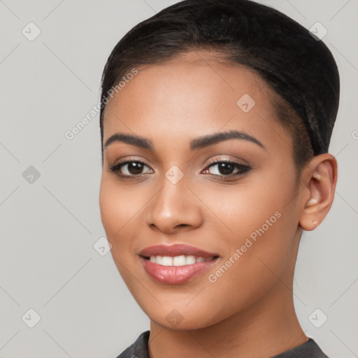 Joyful latino young-adult female with long  brown hair and brown eyes