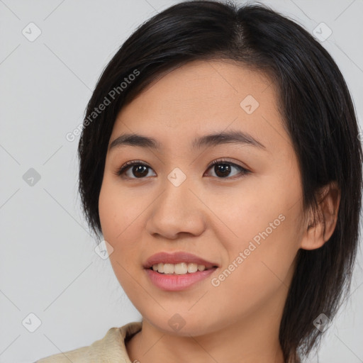 Joyful asian young-adult female with medium  black hair and brown eyes