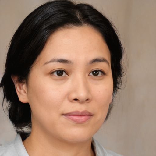 Neutral asian young-adult female with medium  brown hair and brown eyes