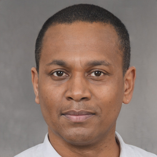 Neutral latino adult male with short  brown hair and brown eyes