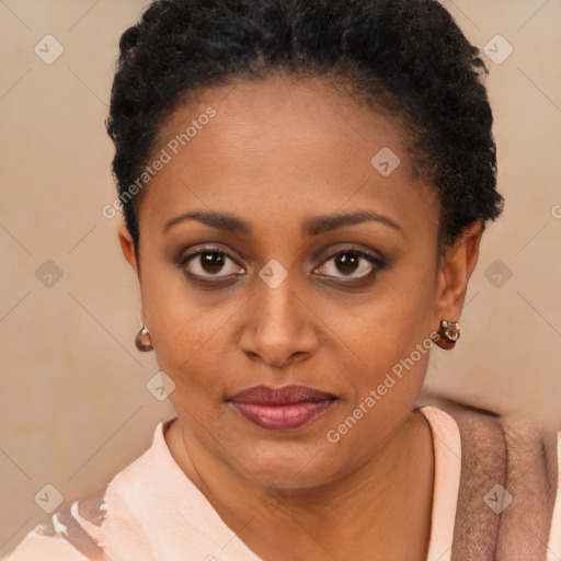 Joyful black young-adult female with short  brown hair and brown eyes