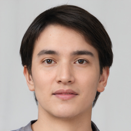 Neutral white young-adult male with short  black hair and brown eyes