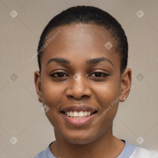 Joyful black young-adult female with short  black hair and brown eyes