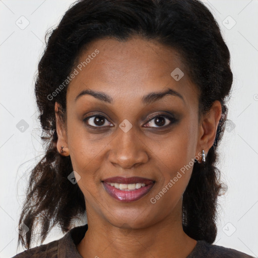 Joyful black young-adult female with long  brown hair and brown eyes