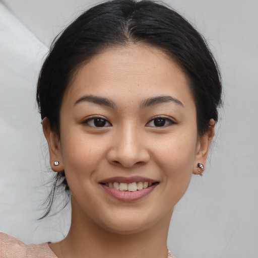 Joyful white young-adult female with medium  brown hair and brown eyes