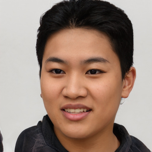 Joyful asian young-adult female with short  black hair and brown eyes
