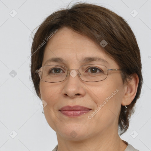 Joyful white adult female with medium  brown hair and grey eyes