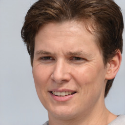 Joyful white adult female with short  brown hair and brown eyes