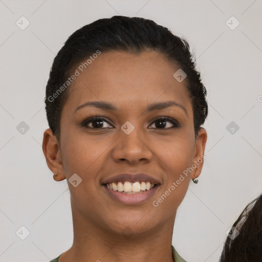 Joyful latino young-adult female with short  brown hair and brown eyes