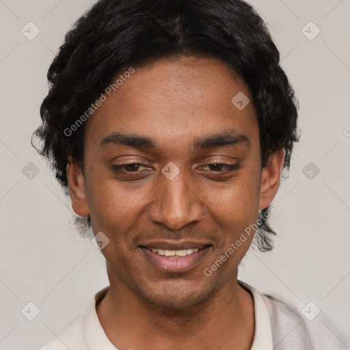 Joyful black young-adult male with short  black hair and brown eyes