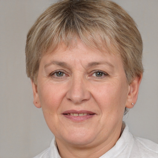 Joyful white adult female with short  brown hair and brown eyes