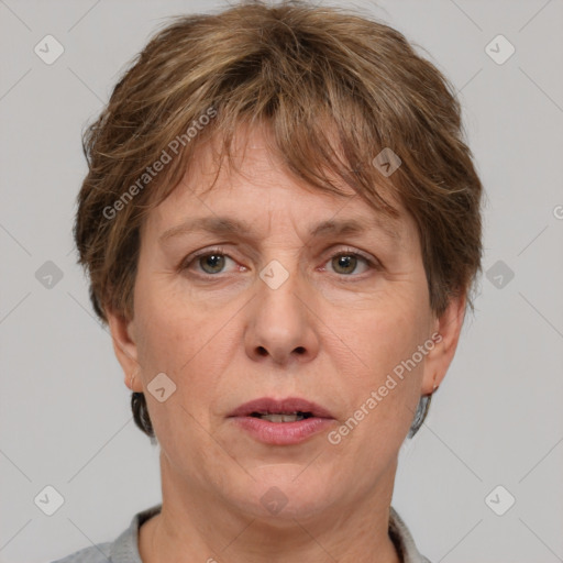 Joyful white adult female with short  brown hair and grey eyes