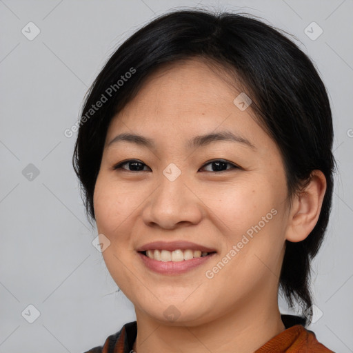 Joyful asian young-adult female with medium  brown hair and brown eyes