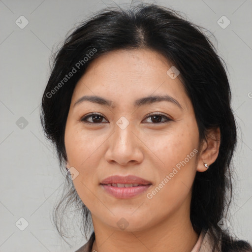 Joyful latino young-adult female with medium  brown hair and brown eyes