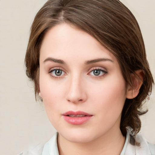 Neutral white young-adult female with medium  brown hair and green eyes