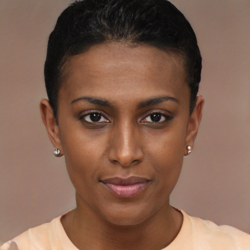 Joyful latino young-adult female with short  brown hair and brown eyes