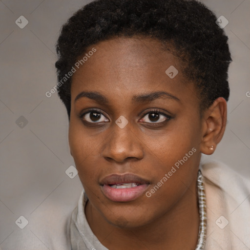 Joyful black young-adult female with short  brown hair and brown eyes