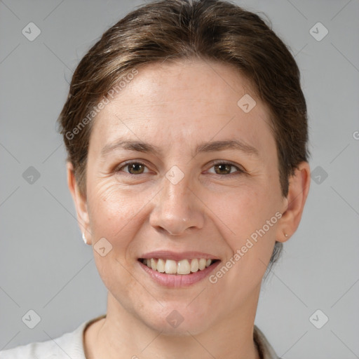 Joyful white adult female with short  brown hair and brown eyes