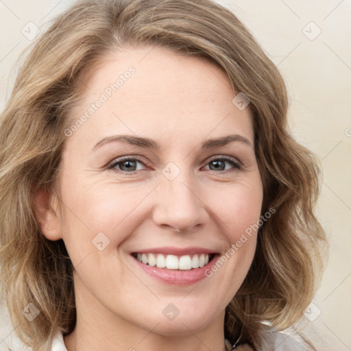 Joyful white young-adult female with medium  brown hair and green eyes