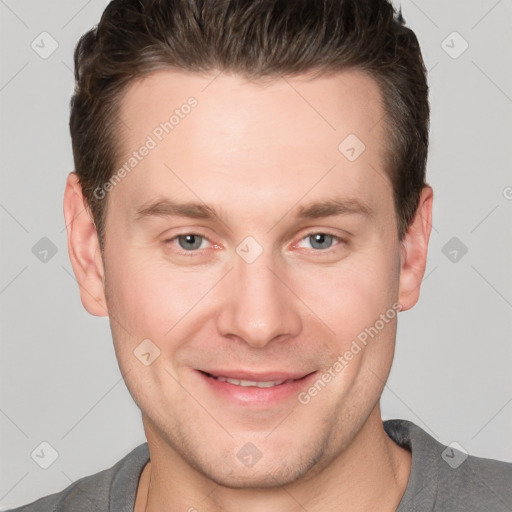 Joyful white adult male with short  brown hair and grey eyes